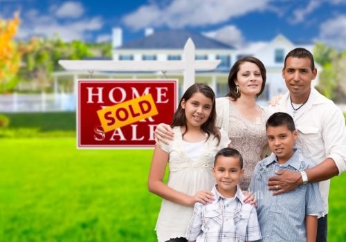 happy-hispanic-family-in-front-of-their-new-house-and-sold-home-for-EEF41G-transformed